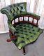 An Antique Style Green Leather Button Captains Chair Delivery Available