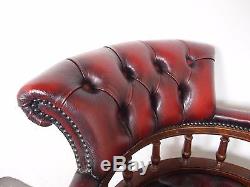 An Antique Style Red Leather Chesterfield Swivel Captains Office Chair