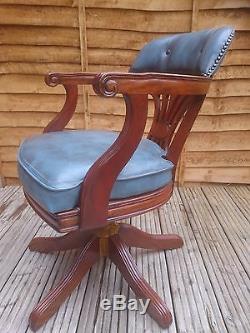 Antique 1960s blue leather mahogany captain I revolving office chair