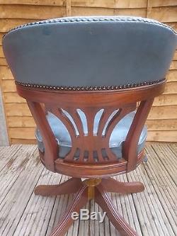 Antique 1960s blue leather mahogany captain I revolving office chair