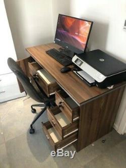 Brown office desk with locking drawers and faux leather chair