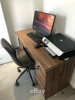 Brown office desk with locking drawers and faux leather chair