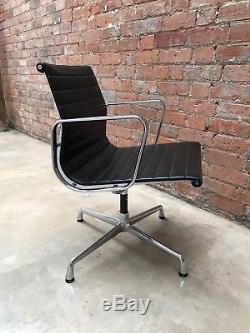Charles Eames Genuine EA108 swivel nero leather chair with armrests, chrome base