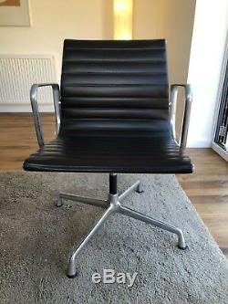 Eames EA104 swivel chair, brown leather