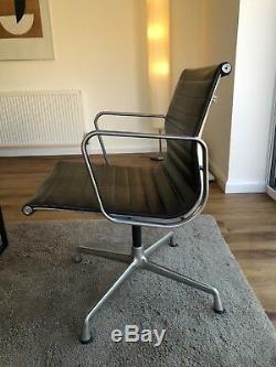 Eames EA104 swivel chair, brown leather