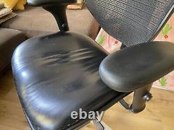 Leather seat mesh back office chair, similar to Herman Miller