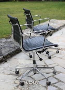 Pair Retro Eames Style Leather and chrome office chairs