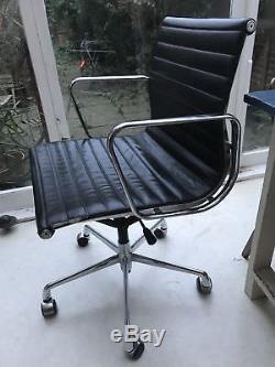 Pair Retro Eames Style Leather and chrome office chairs