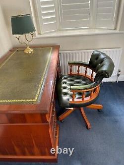 Reproduction office table, leather captains swivel chair and desk lamp