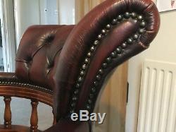 Vintage red leather chesterfield captains chair